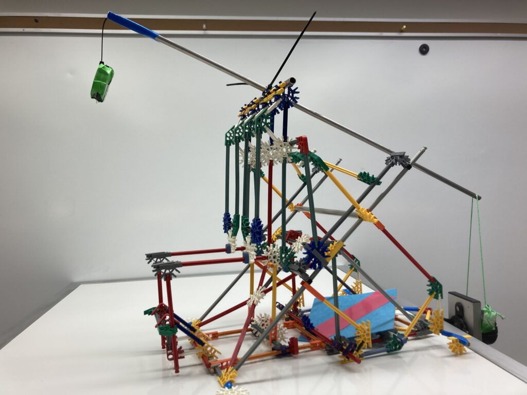 A K'Nex Trebuchet with a hinged counterweight and swinging projectile