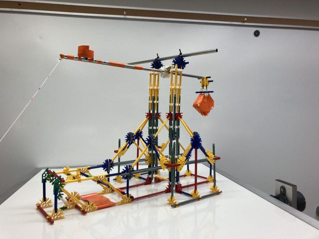 A K'Nex Trebuchet with a hinged counterweight and swinging projectile