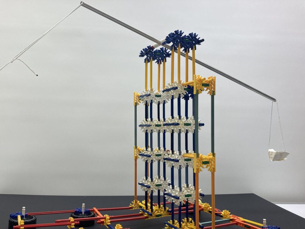 A large K'Nex trebuchet with a sling and a hinged counterweight